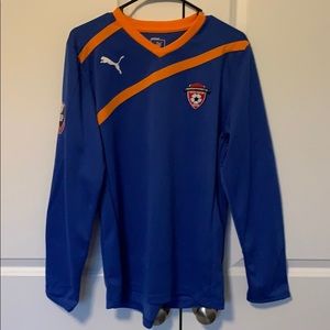 Once used goalie jersey with elbow padding.